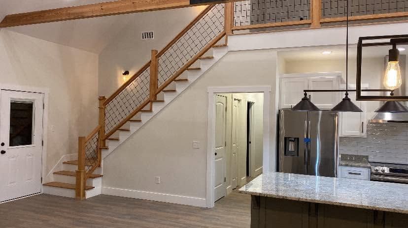 Finished entry and staircase with pendant lighting